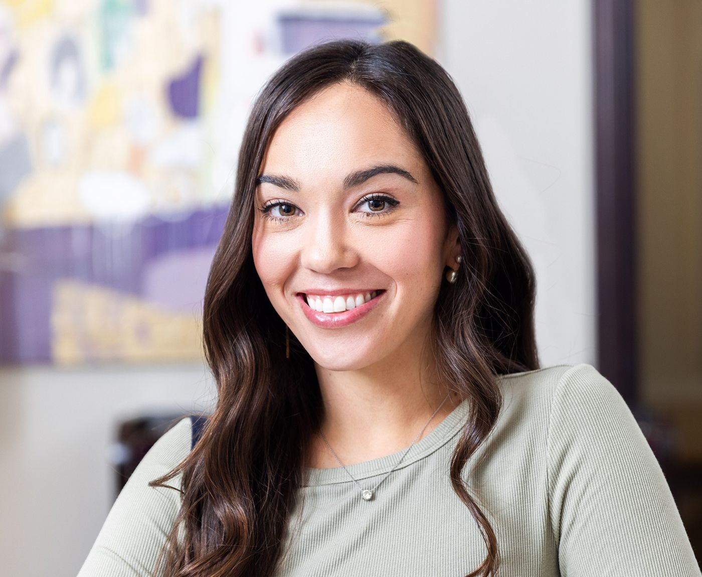 Smiling woman in a professional setting.