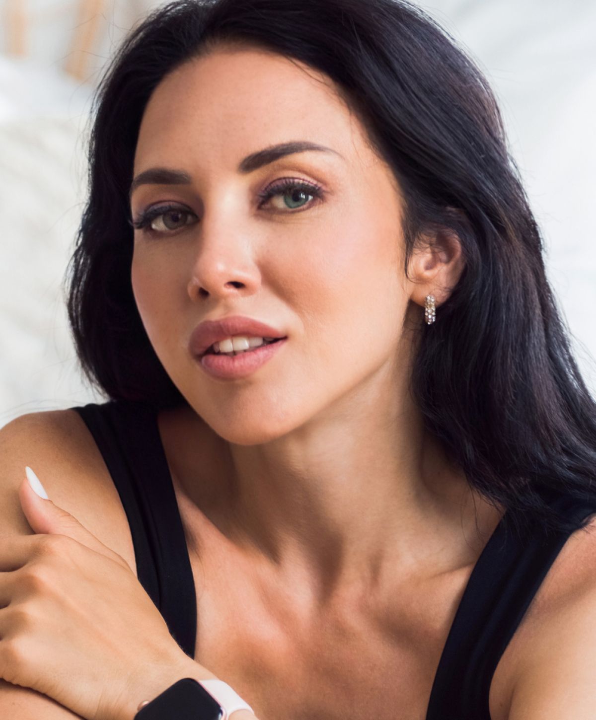 Close-up portrait of a woman with dark hair.