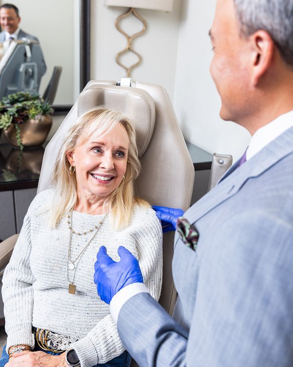 Patient consulting with healthcare professional in clinic.