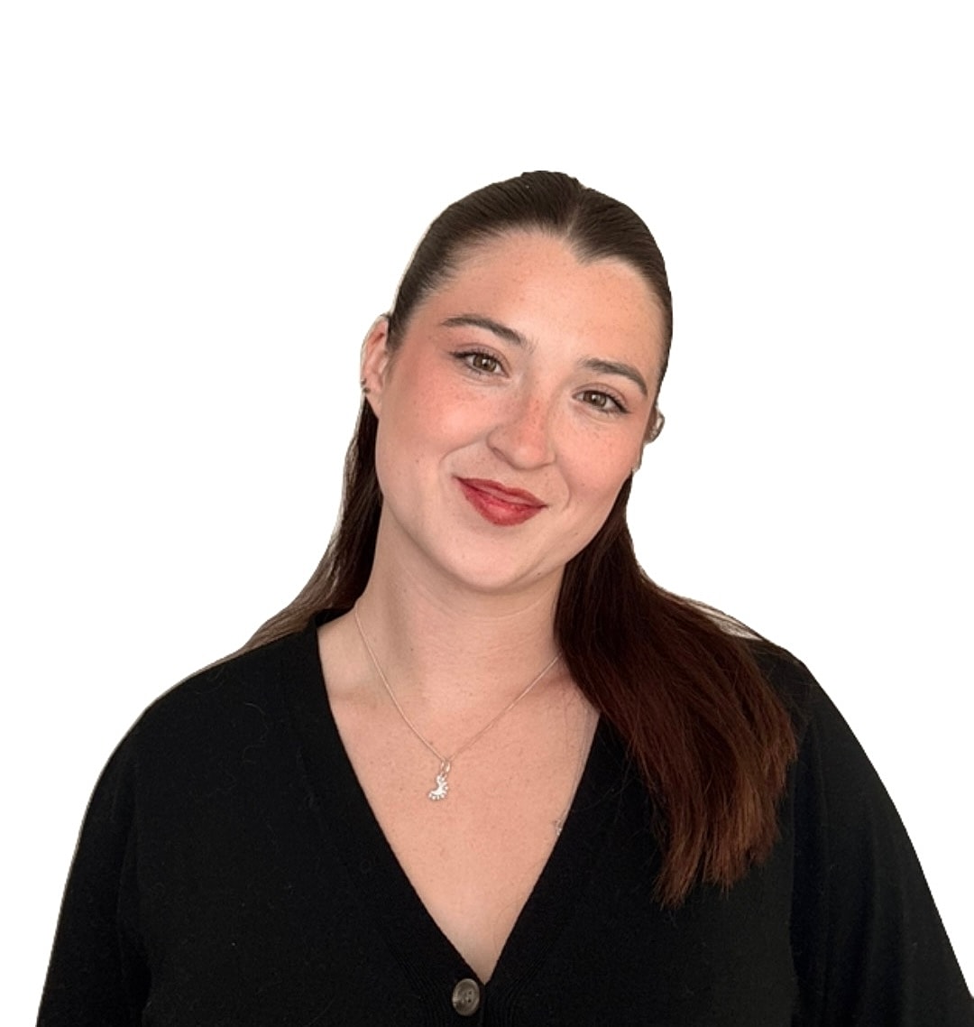 Smiling woman with long brown hair and necklace.
