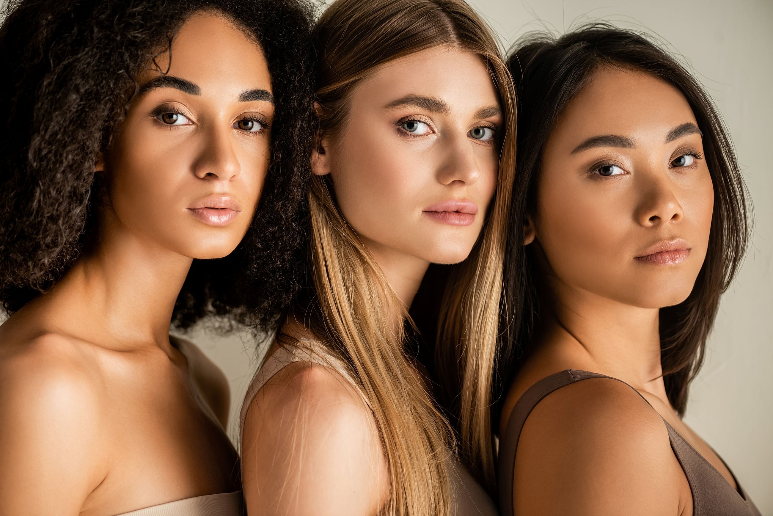 Diverse women showcasing natural facial proportions and healthy skin, representing personalized facial rejuvenation.